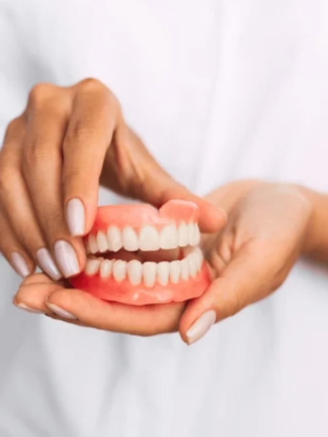 dentist-holding-dentures-his-hands-600nw-1440706979