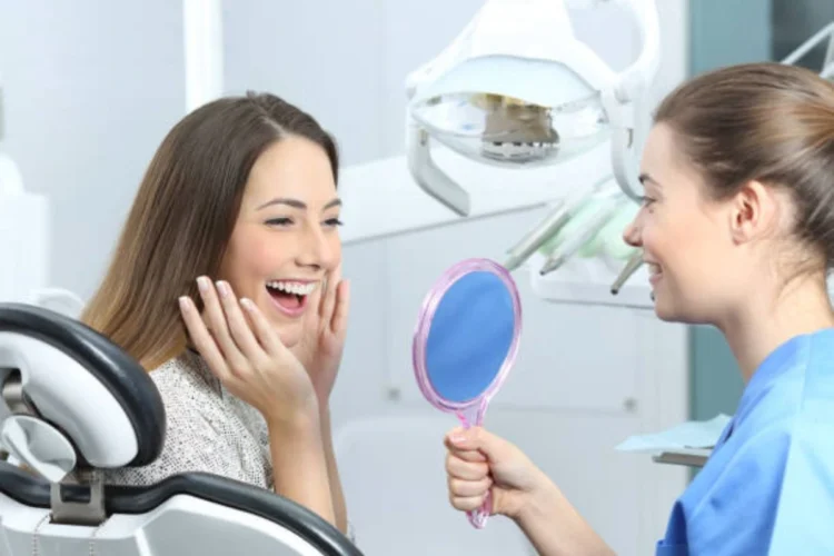 A dental professional discussing how dental implants works and improves oral health and quality of life