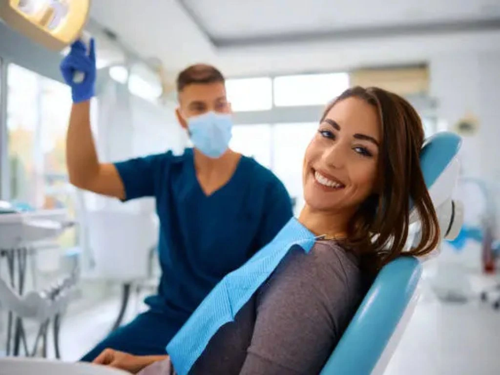 A dentist examining a patient's teeth to assess dental care and ensure oral hygiene for a healthy smile