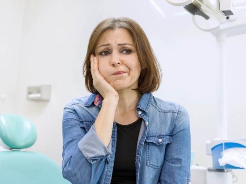 Patient receiving emergency dental treatment for urgent dental issue