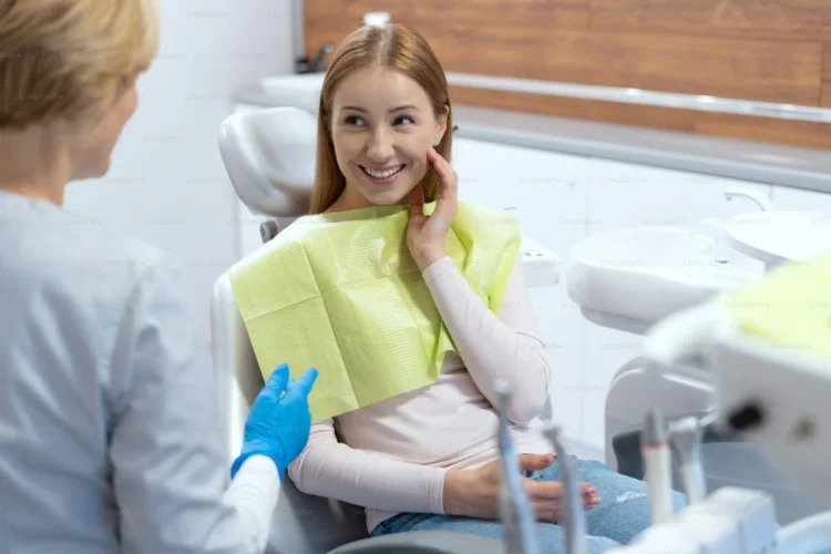 Dental implants consultation with a dentist discussing pricing and painless treatment options for patients