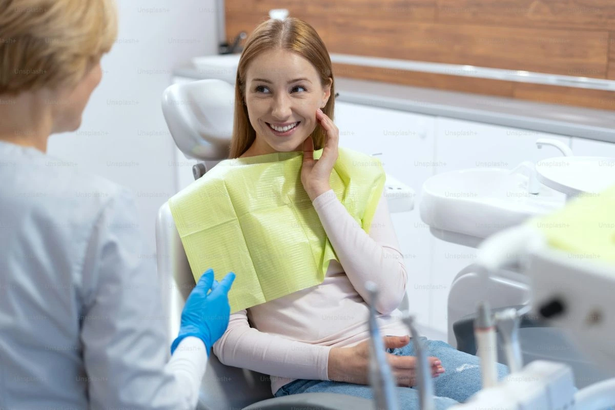 Dental implants consultation with a dentist discussing pricing and painless treatment options for patients
