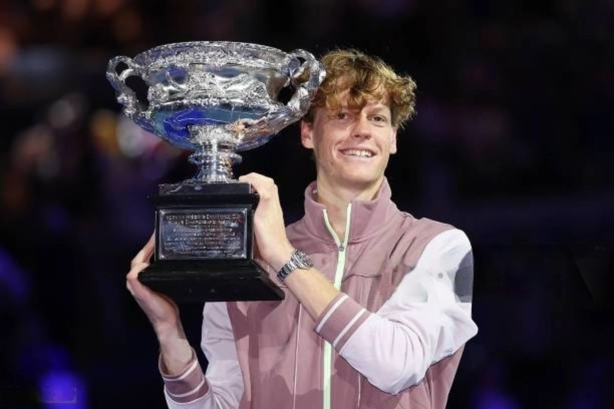 Champion holding Australian Open trophy with teeth whitening for a bright smile
